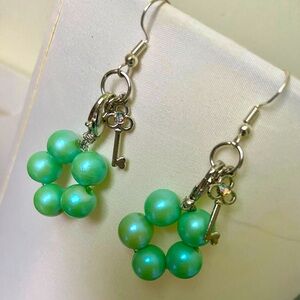 Silver Azure pearl diamond key earrings.